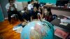 Christian Burmese refugees sit in a classroom in Kuala Lumpur, Malaysia, March 11, 2017. An Associated Press analysis suggests that the people hurt most by President Donald Trump's planned deep cuts in refugee visas are from not any of the six Muslim countries listed in his travel ban, but Myanmar.