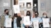 A group of Thai demonstrator holds the portraits of late Vicha Ratanapakdee, during a rally to raise awareness of anti-Asian violence outside the Hall of Justice, SF, March 4, 2021