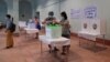 ယခင်မှတ်တမ်းရုပ်ပုံ | ၂၀၂၀ အထွေထွေရွေးကောက်ပွဲအတွင်း ရန်ကုန်မြို့ မဲရုံတခုမှာ ဆန္ဒမဲထည့်ဝင်နေသူ ပြည်သူတဦး (နိုဝင်ဘာ ၈၊ ၂၀၂၀)