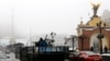 A Ukrainian military vehicle goes down the street on Independence Square in Kyiv, Ukraine, Jan. 23, 2015. 