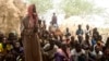 FILE - Residents of Zibane-Koira Zéno, a village in the Tillabéri region (western Niger close to Mali) attends a meeting on May 12, 2020, after an attack by armed men on May 8, 2020.