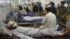 Injured victims of Friday's bombing at a busy market, is treated at Lady Reading Hospital in Peshawar, Pakistan, Saturday, July 27, 2013. Hospital official Shabir Hussain said almost all the dead and wounded were Shiites. There was no claim of responsibil