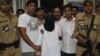 Indian police officers escort Mumbai attacks suspect Syed Zabiuddin, face covered, out from a government hospital in New Delhi, India on June 29, 2012.
