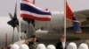 Thailand's Deputy Supreme Commander Gen. Montri Sangkhasap, left, and First Secretary to the U.S. Embassy in Thailand James F. Entwistle, right, review the honor guard at the opening ceremony of the 27th Cobra Gold military exercise in Nakhon...