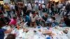 Anti-government protesters eat as they break their fast on the first day of the holy month of Ramadan at Taksim Square in Istanbul, Turkey, July 9, 2013. 
