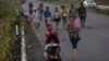 Central American migrants traveling with a caravan to the U.S. make their way to Pijijiapan, Mexico, Oct. 25, 2018. 