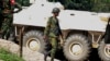 A Bangladeshi soldier walks as they try to flush out Islamist radicals who have holed up in a building with a large cache of ammunition in the city of Sylhet, Bangladesh, March 26, 2017. 