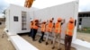 Virginia Tech students erect a futuristic solar home as they prepare to compete in the Solar Decathlon Middle East, an international collegiate competition to build the world’s smartest solar home.