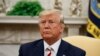 President Donald Trump pauses while speaking during a meeting with Romanian President Klaus Iohannis in the Oval Office of the White House, Aug. 20, 2019, in Washington.
