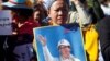 Supporters of Kem Sokha, leader of the Cambodia National Rescue Party (CNRP), stand outside the court during a hearing for the jailed opposition leader in Phnom Penh, Cambodia, Sept. 26, 2017.
