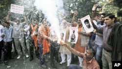 Activists of Bajarang dal, a Hindu rights group, shout slogans and burn firecrackers to celebrate Mohammed Ajmal Kasab's execution, in New Delhi, India, November 21, 2012.