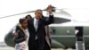 President Barack Obama,Michelle Obama and their daughters Sasha and Malia, walk from Marine One to board Air Force One at Chicago O'Hare International Airport, Nov. 7, 2012, in Chicago.