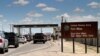 FILE - This Sept. 9, 2014 file photo shows cars wait to enter Fort Bliss in El Paso, Texas. 