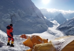 FILE - Pemba Dorjee Sherpa, 20 times Everest summiteer is seen on the camp three during the expedition of Everest, Nepal, May 20, 2019.