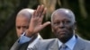 FILE PHOTO: Angola's President Jose Eduardo dos Santos waves as he leaves Sao Bento Palace after a meeting with Portuguese Prime Minister Jose Socrates in Lisbon