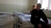 FILE - A inmate sits in the multi-drug resistant tuberculosis [MDR-TB] ward in a prison hospital in the Siberian city of Tomsk, about 3,500 kilometers east of Moscow, Russia.
