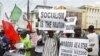 Trade union members display placards during a protest, in Lagos, Nigeria, Wednesday, Nov. 10, 2010. Trade unions protesting Nigeria's minimum wage have called a warning strike across the oil-rich nation. Wednesday's strike by the Nigerian Labor Congress a