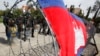 Opposition Officials Charged After Tuesday's Violence