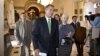 House Speaker John Boehner of Ohio is pursued by reporters as he walks to the House floor to deliver remarks about negotiations with President Barack Obama on the fiscal cliff, Tuesday, Dec. 11, 2012, on Capitol Hill in Washington.