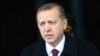 FILE - Turkey's President Tayyip Erdogan arrives for a welcoming ceremony at the Presidential Palace in Ankara, March 3, 2015. 