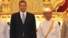US Ambassador to Burma Derek Mitchell (L) poses for a photograph next to Burmese President Thein Sein at his residence in Naypyidaw on July 11, 2012. 