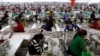 Employees work at a factory supplier of the H&M brand in Kandal province, Cambodia, Dec. 12, 2018.