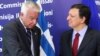 European Commission President Jose Manuel Barroso, right, welcomes Greek Prime Minister Panagiotis Pikrammenos at the European Commission headquarters in Brussels, May 23, 2012. 