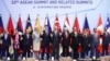 ASEAN leaders and delegates pose for a photo during a working lunch on the sidelines of the 33rd ASEAN summit in Singapore, Nov. 14, 2018. 