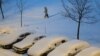 Hujan salju dan suhu minus 7 derajat Celsius di Minsk. (Reuters/Vasily Fedosenko) 