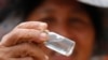 A local prospector displays flecks of gold found in the Klong Thong, or "Golden Canal" in Prachuap Khiri Khan province, southern Thailand, Jan. 19, 2017.