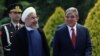 Turkey's President Abdullah Gul, right, and his Iranian counterpart Hassan Rouhani speak as they walk together during a ceremony at the Cankaya Palace in Ankara, Turkey, June 9, 2014. 