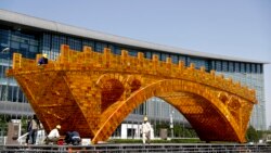 VOA Asia – Ideologically different world development plans compete