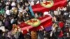 People carry the coffins of the Kurdish activists who were shot in Paris, during a funeral ceremony in Diyarbakir, Turkey, January 17, 2013. 