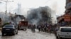 Firefighters work at one explosion site in Reyhanli, near Turkey's border with Syria, May 11, 2013.