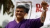 Malaysian cartoonist Zulkiflee Anwar Alhaque, better known as Zunar, wearing a prison outfit and plastic handcuffs poses for photographers prior to launching his book in Petaling Jaya, Malaysia, Feb. 14, 2015.