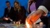 FILE - Members of Survivors Network of those Abused by Priests (SNAP) light candles during a protest to denounce abuses in Rome, April 25, 2014.
