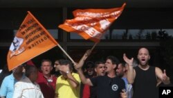 Workers protest in front of the Interior Ministry in central Athens, Greece, November 7, 2012. 