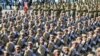 FILE - Iranian army troops march in a parade marking National Army Day just outside Tehran, Iran, April 17, 2016. A new force was announced Thursday, designed to fight in Arab countries and would recruit heavily from non-Iranian Shi'ite Muslims across the region.