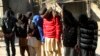 FILE - Pakistani suspects allegedly associated with the Islamic State group, wait to appear in an anti-terrorism court in Gujranwala, Pakistan, Dec. 29, 2015. On Thursday, authorities in Pakistan announced they captured a group of eight militants operating a recruitment cell.