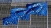 FILE PHOTO: European Union flags flutter outside the EU Commission headquarters in Brussels
