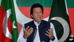 FILE - Followers of Pakistani opposition leader Imran Khan, shown at an April press conference, have planned a demonstration seeking the resignation of Prime Minister Nawaz Sharif. The government on Thursday banned political gatherings in Islamabad.