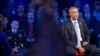 President Barack Obama watches the replay of his emotional speech from earlier this week during a CNN televised town hall meeting at George Mason University in Fairfax, Va., Thursday, Jan. 7, 2016.
