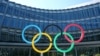 FILE -: The Olympic rings are pictured in front of the International Olympic Committee (IOC) during the coronavirus disease (COVID-19) outbreak in Lausanne, Switzerland, March 24, 2020.