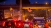An Ethiopia national flag, left, is seen next to a U.S. flag, center, in a busy street ahead of U.S. President Barack Obama's visit to Addis Ababa, Ethiopia, Saturday, July 25, 2015.