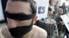 FILE - Syrian opposition members take part in a demonstration calling for more human rights in Syria, including putting a stop to physical torture in prisons, Beirut, Lebanon.