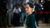 FILE - In this March 15, 2016 file photo, National League for Democracy party (NLD) leader Aung San Suu Kyi arrives in Manama's parliament in Naypyitaw, Myanmar. 