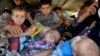 Displaced people, who fled from the violence in the province of Nineveh, arrive at Sulaimaniya province, Iraq, Aug. 8, 2014.