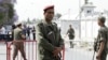 A Tunisian army officer stands guard outside the Bouchoucha military base after shooting in Tunis, Tunisia May 25, 2015. 