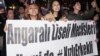 Students march during a rally to protest against Turkish Prime Minister Recep Tayyip Erdogan’s recent remarks suggesting his Islamic-oriented government could segregate female and male students living in private accommodation, in Ankara, Turkey, Nov. 9, 2