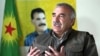 Murat Karayilan, acting military commander of the Kurdistan Workers Party (PKK), speaks during an interview with Reuters at the Qandil mountains near the Iraq-Turkish border in Sulaimaniya, 330 km (205 miles) northeast of Baghdad, Mar. 24, 2013. 